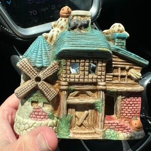 Whimsical ceramic‎ house with pumpkin, bats, and windmill votive holder